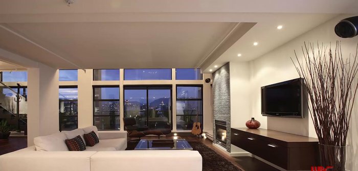 Mix furniture of various sizes and textures for visual interest, while maintaining balance.