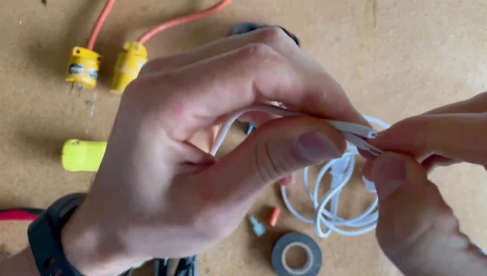 Strip the insulation from the ends of the wires using wire strippers.