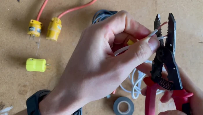 Strip the insulation from the ends of the wires using wire strippers.