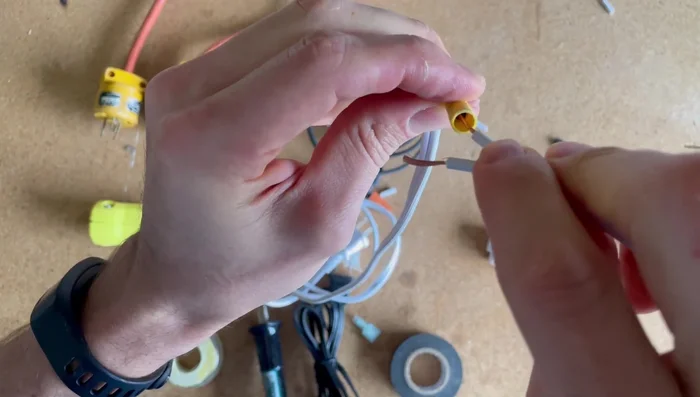 Crimp the connector firmly using crimpers. Ensure a solid connection by tugging gently.