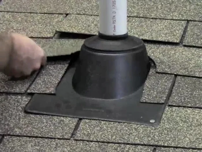 Seal the collar: Apply roofing compound over the nails and any gaps to ensure a waterproof seal.