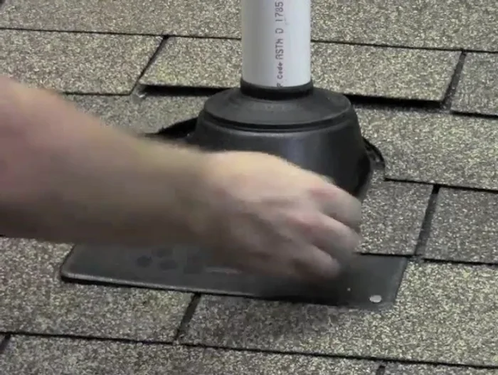 Adjust shingles if necessary: If the new collar doesn't fit perfectly under the existing shingles, you may need to trim the shingles slightly to allow for a flush fit.