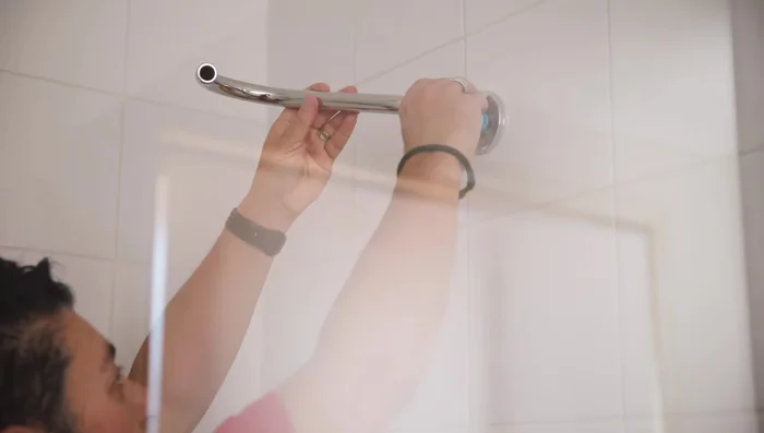 If installing a new cover plate, attach it before the shower head.