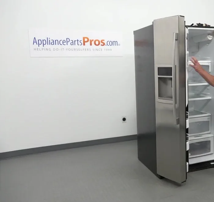 Install the hinge lock, plug in the door harness, and install the cover, ensuring the harness is inside the hinge.