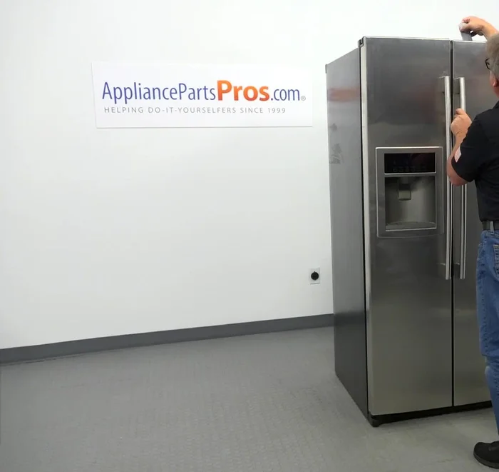 Install the hinge lock, plug in the door harness, and install the cover, ensuring the harness is inside the hinge.