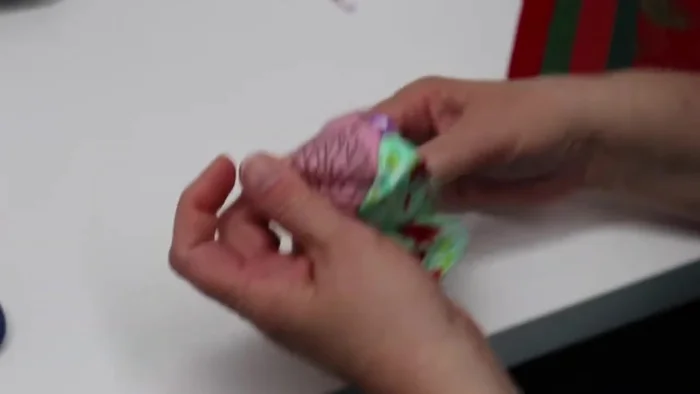 Turn the coaster right side out, using a chopstick or the edge of scissors to gently push out the corners. Make sure your bottom fabric is on the bottom and all folded fabrics are on top.