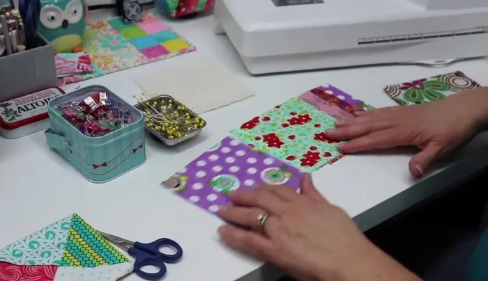 Fold all fabric squares into triangles and lightly finger press.