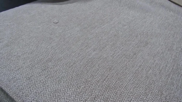 Carefully trim away the burned fabric, being mindful not to enlarge the hole.