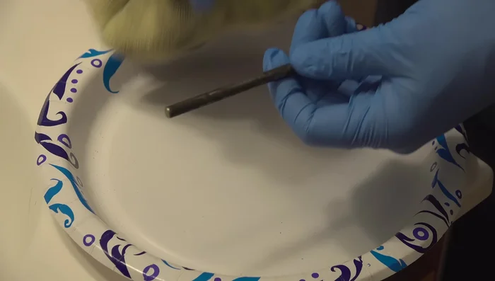 Lightly sand any rust or pitting on the pin for a smoother surface.