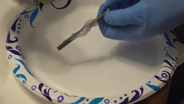 Apply Super Lube (or thick grease) liberally to the pin and hinge.