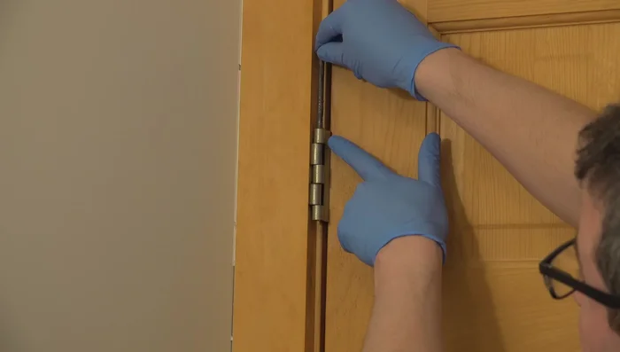 Use a block of wood for leverage if necessary to gently tap the pin back into place.