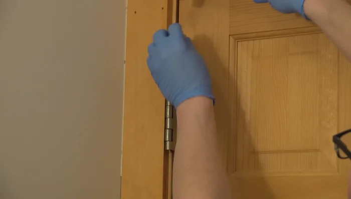 Use a block of wood for leverage if necessary to gently tap the pin back into place.