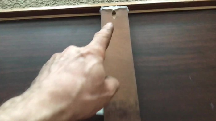 Stand the drawer upright and assess the damage. Note the missing screws.