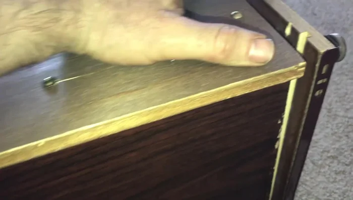 Use a longer screw where the board originally split for improved stability and to reach deeper into the wood. Tighten by hand to prevent splitting.