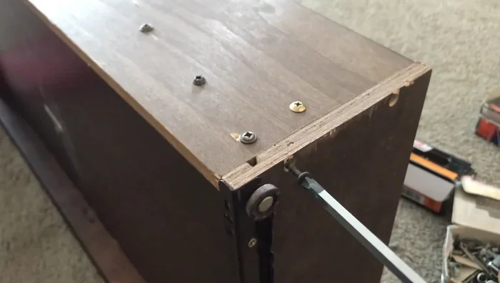 Use a longer screw where the board originally split for improved stability and to reach deeper into the wood. Tighten by hand to prevent splitting.