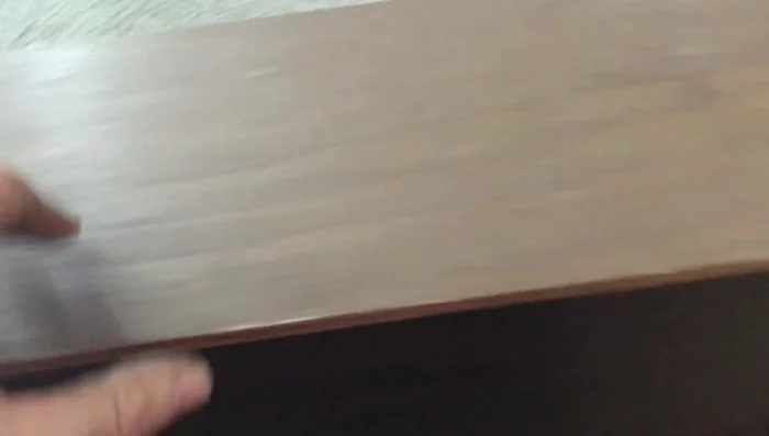 Stand the drawer upright and assess the damage. Note the missing screws.