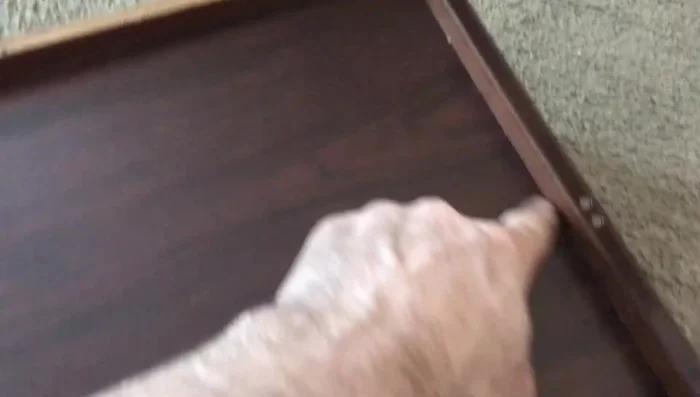 Tighten existing screws and add new screws to reinforce the connection.