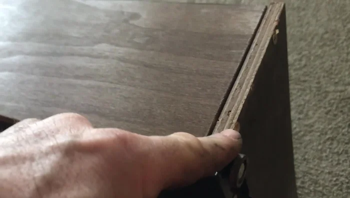 Tighten existing screws and add new screws to reinforce the connection.