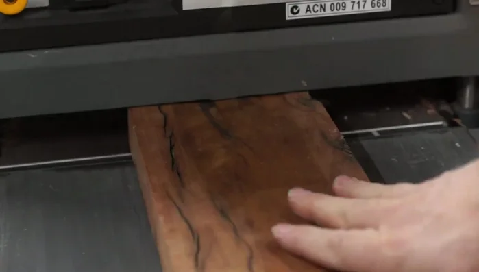 Sand and polish the hardwood base after resin cures.