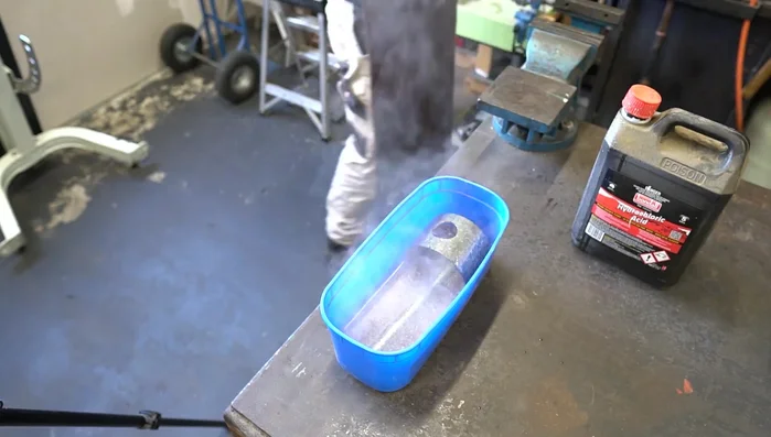 Remove zinc coating from galvanized steel using acid, rinse thoroughly.