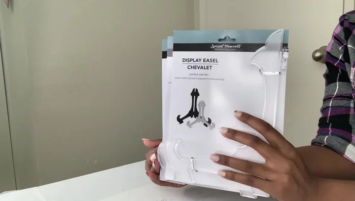 Attach the top tray: Use a mirror or sturdy backing to create a stable surface for attaching the top tray to the display panels.