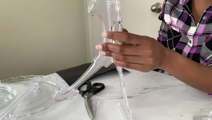 Attach the top tray: Use a mirror or sturdy backing to create a stable surface for attaching the top tray to the display panels.