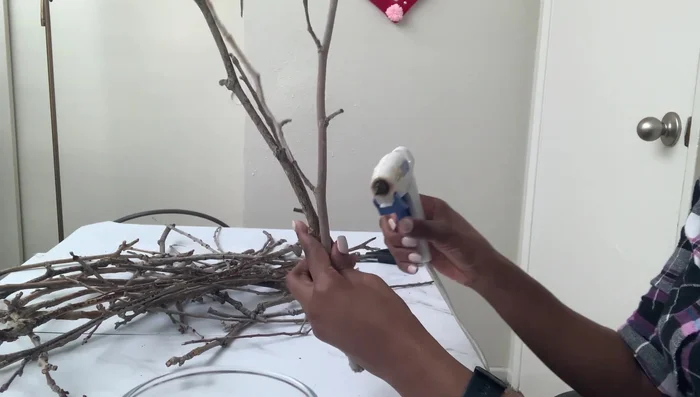 Spray paint the branch: Spray paint the branch silver.