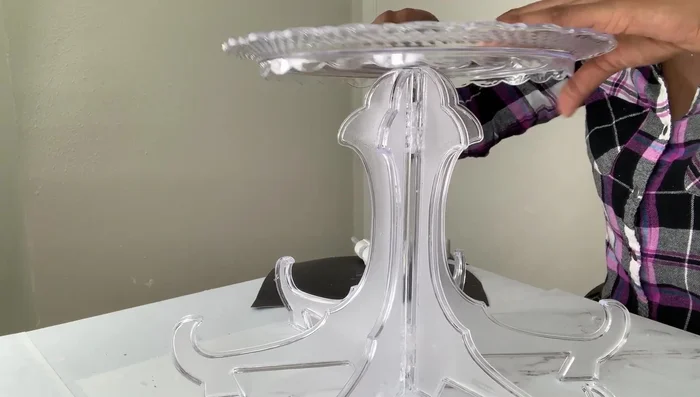 Attach the top tray: Use a mirror or sturdy backing to create a stable surface for attaching the top tray to the display panels.