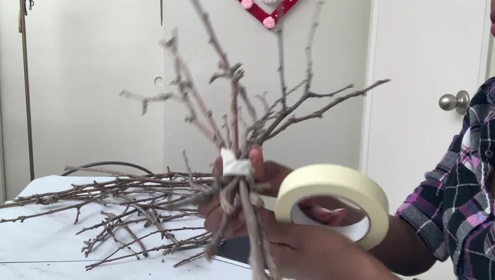 Spray paint the branch: Spray paint the branch silver.