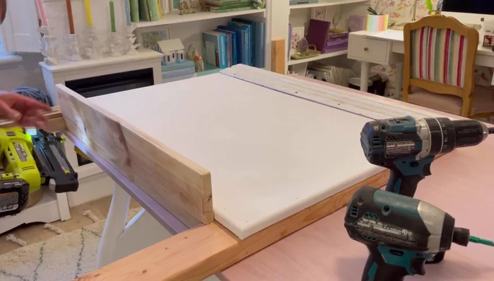 Attach the bottom ledge, using screws for sturdiness.