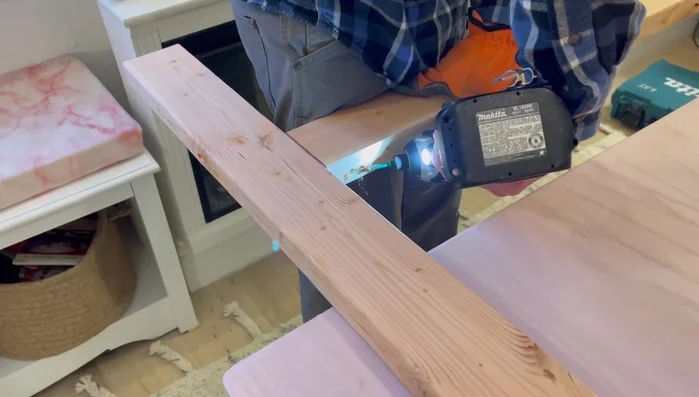 Attach the top support piece for the window opening.