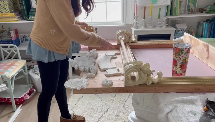 Apply wood filler to nail holes and sand smooth.