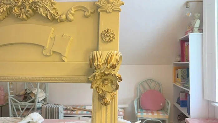 Attach the theater sign using gold vinyl or store-bought letters.