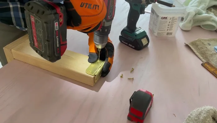 Upholster the side supports with fabric and staple/glue in place.