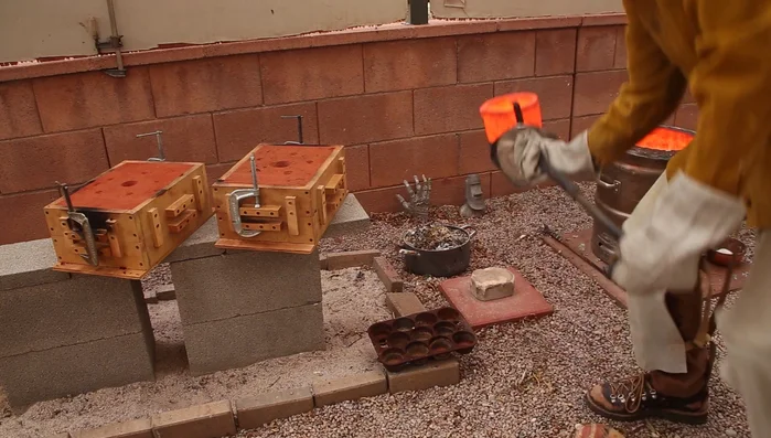 Pour molten copper into the molds quickly and carefully.