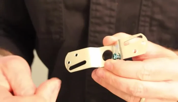 Mount the new light's mounting bracket to the junction box using shorter screws.