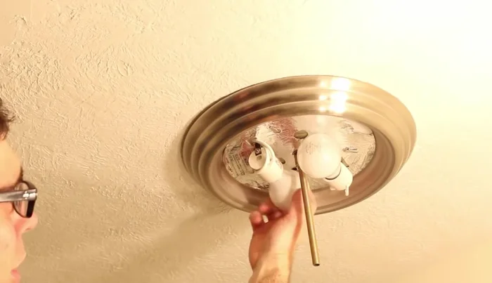 Install the light bulbs and shade.