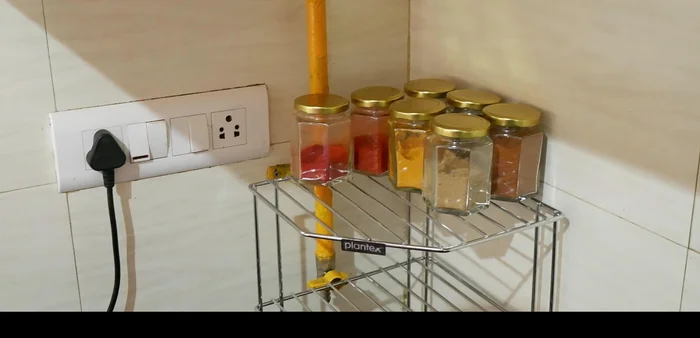 Utilize vertical space with racks to keep countertops clean and spacious.