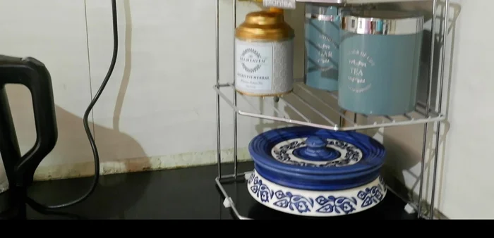 Utilize vertical space with racks to keep countertops clean and spacious.