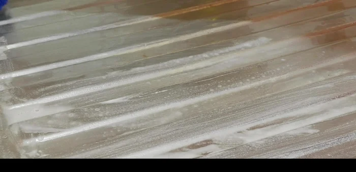 Apply the paste, leave it for half an hour, then scrape and clean with a brush, and wash with hot water.