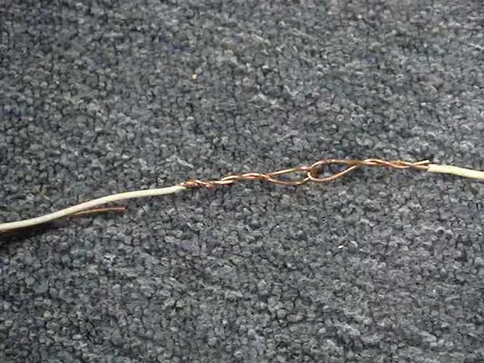 Create a taper on the NM cable end to prevent catching during pulling.