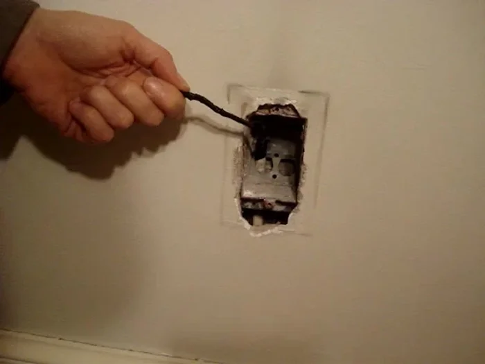 Pull the new NM cable through. If resistance is high, stop to avoid damage.