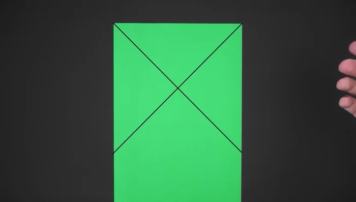 Fold the paper in half vertically. Bring the right side to the left, unfold.