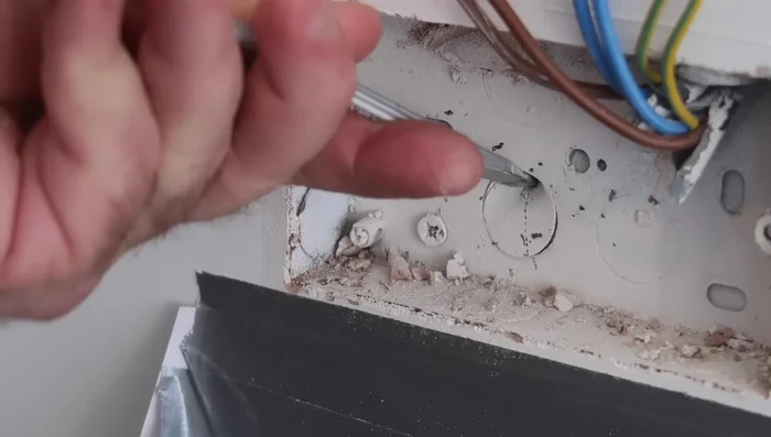 Drill a hole through the brick wall using a drill bit slightly larger than the cable.