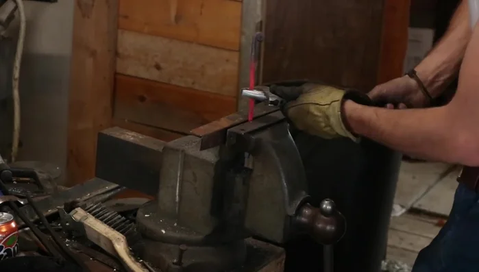 Heat the marked section for twisting. Use a crescent wrench (or twisting tool) to twist the rod.