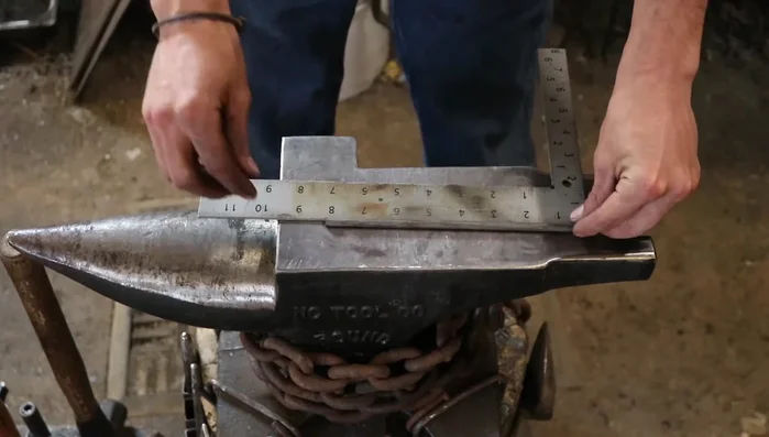 Create a point on one end of the rod by drawing it out and then rounding the section.