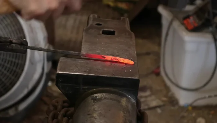 Create a point on one end of the rod by drawing it out and then rounding the section.