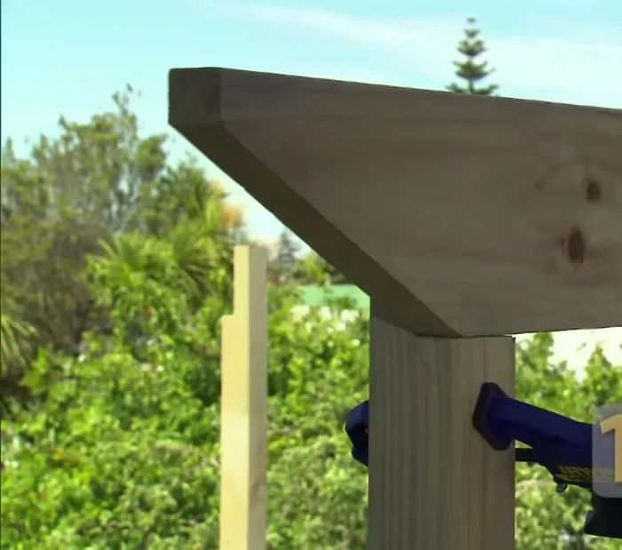 Attach beams to rafters.