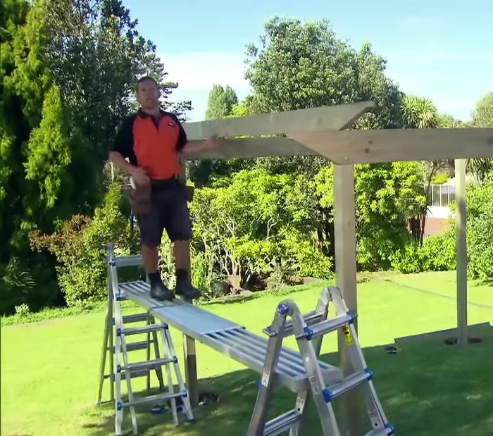 Attach beams to rafters.