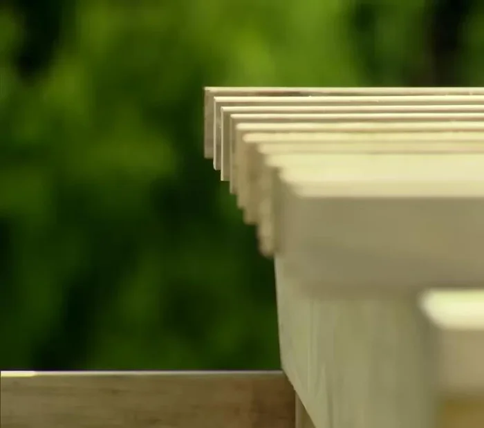 Attach beams to rafters.